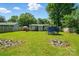 A view of the grassy backyard with room to run around, play games, or relax in a peaceful outdoor setting at 6718 Pueblo Ln, Charlotte, NC 28227
