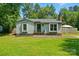 Single story house with a landscaped front yard at 6718 Pueblo Ln, Charlotte, NC 28227