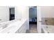 This bathroom has double sinks, a bathtub, and a doorway to another room at 679 Cape Fear St, Fort Mill, SC 29715