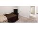 A cozy bedroom with carpet and a dark wood bed and dresser offers comfort and style at 679 Cape Fear St, Fort Mill, SC 29715