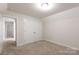 The bedroom is carpeted with an overhead light and a double closet at 679 Cape Fear St, Fort Mill, SC 29715