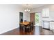 This dining room features hardwood floors, a chandelier, and a table with seating for four at 679 Cape Fear St, Fort Mill, SC 29715