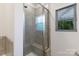 This shower features tiled walls and a glass door with a built-in bench seat at 679 Cape Fear St, Fort Mill, SC 29715