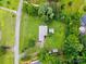Bird's eye view of a home with driveway, shed, and large manicured lawn and mature trees at 6900 Ridge Lane Rd, Charlotte, NC 28262