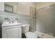 Bathroom with gray tile and white vanity offering a shower and sink at 6900 Ridge Lane Rd, Charlotte, NC 28262