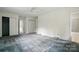 Spacious bedroom showcasing carpet, multiple closets, and doorway to the attached bathroom at 6900 Ridge Lane Rd, Charlotte, NC 28262