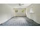 Spacious bedroom with three windows and a ceiling fan providing natural light and air circulation at 6900 Ridge Lane Rd, Charlotte, NC 28262