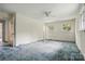 Spacious bedroom featuring carpet, bright natural light, and a ceiling fan adding comfort and style at 6900 Ridge Lane Rd, Charlotte, NC 28262