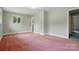 Bedroom featuring light-colored walls, a window, carpet and ample natural light at 6900 Ridge Lane Rd, Charlotte, NC 28262