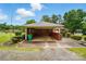 Attached carport offers convenient parking and protection from the elements, with a brick and wood construction at 6900 Ridge Lane Rd, Charlotte, NC 28262
