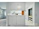 Kitchen with bright white cabinets, white countertops, and patterned tile floor at 6900 Ridge Lane Rd, Charlotte, NC 28262