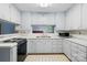Charming kitchen offers lots of cabinet space, countertops, sink, and modern appliances at 6900 Ridge Lane Rd, Charlotte, NC 28262