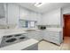 Kitchen features ample cabinet space, countertops, stainless steel sink, and appliances at 6900 Ridge Lane Rd, Charlotte, NC 28262