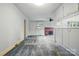 Spacious living room with fireplace, ceiling fan, and view into the kitchen at 6900 Ridge Lane Rd, Charlotte, NC 28262