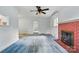 Light filled living room with fireplace, neutral paint, and large windows at 6900 Ridge Lane Rd, Charlotte, NC 28262