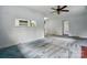 Open living room with connecting spaces, ceiling fan, and neutral paint at 6900 Ridge Lane Rd, Charlotte, NC 28262