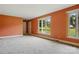 Bright and airy living room with fresh carpet and natural light, showcasing a comfortable and welcoming space at 6900 Ridge Lane Rd, Charlotte, NC 28262