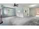 Living room with ceiling fan, large window, and open floor plan at 6900 Ridge Lane Rd, Charlotte, NC 28262