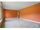 Bright living room features large windows, carpeted floor, and fresh paint at 6900 Ridge Lane Rd, Charlotte, NC 28262