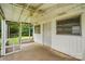 Enclosed sunroom with a ceiling fan offering a view of the backyard at 6900 Ridge Lane Rd, Charlotte, NC 28262