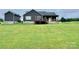 A well-kept yard features a deck and trampoline, perfect for outdoor enjoyment and recreation at 7133 Church Rd, Taylorsville, NC 28681