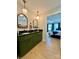 Bathroom features double sink with dark green cabinetry and views into an adjacent bedroom at 7133 Church Rd, Taylorsville, NC 28681