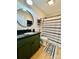 Stylish bathroom featuring a green vanity, modern fixtures, and a black and white patterned shower curtain at 7133 Church Rd, Taylorsville, NC 28681