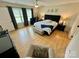 Bright and airy bedroom with a plush bed, and decorative 'A & M' initials above at 7133 Church Rd, Taylorsville, NC 28681