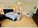 Spacious bedroom featuring a large bed, cozy chair, and ample natural light at 7133 Church Rd, Taylorsville, NC 28681