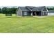 Side angle of home featuring expansive yard at 7133 Church Rd, Taylorsville, NC 28681