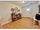 Inviting foyer with wood flooring, decorative accents and bench seating at 7133 Church Rd, Taylorsville, NC 28681