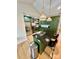 Granite kitchen island with a stainless steel sink, modern faucet, and stylish woven pendant lights at 7133 Church Rd, Taylorsville, NC 28681