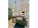 Kitchen island with a stainless steel sink, and open views to the connected living room at 7133 Church Rd, Taylorsville, NC 28681