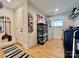 Well-lit laundry room with black washer/dryer, storage shelving, and convenient access to the exterior at 7133 Church Rd, Taylorsville, NC 28681
