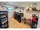 Well-organized laundry room with black washer/dryer, storage shelving, and natural light at 7133 Church Rd, Taylorsville, NC 28681