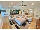 Open-concept living room with a large sectional sofa and access to kitchen at 7133 Church Rd, Taylorsville, NC 28681