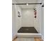 Modern walk-in shower with white subway tile and black fixtures, offering a sleek and contemporary design at 7133 Church Rd, Taylorsville, NC 28681