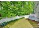Green backyard featuring a back deck with patio chairs at 727 Torrey Pines Ln, Fort Mill, SC 29715