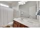Bright bathroom featuring a white vanity, commode, and a shower with a curtain at 727 Torrey Pines Ln, Fort Mill, SC 29715