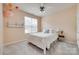 Bright bedroom featuring a ceiling fan and a window with blinds at 727 Torrey Pines Ln, Fort Mill, SC 29715