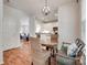 Dining area with hardwood floors that connect to the kitchen and living area at 727 Torrey Pines Ln, Fort Mill, SC 29715