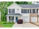 Charming two-story home with white siding, black shutters, and attached one-car garage at 727 Torrey Pines Ln, Fort Mill, SC 29715