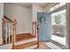 Inviting foyer featuring wood flooring and a stairway leading to the upper level at 727 Torrey Pines Ln, Fort Mill, SC 29715
