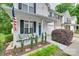 Cozy front porch with seating area and a view of the landscaped front yard at 727 Torrey Pines Ln, Fort Mill, SC 29715