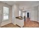 Bright eat-in kitchen with stainless steel appliances and views into the dining area at 727 Torrey Pines Ln, Fort Mill, SC 29715
