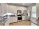 Efficient kitchen with stainless steel appliances and white cabinetry at 727 Torrey Pines Ln, Fort Mill, SC 29715