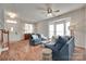Open-concept living area with hardwood floors, blue sofas, and a bright, inviting atmosphere at 727 Torrey Pines Ln, Fort Mill, SC 29715