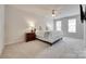 Bright main bedroom with carpet, a ceiling fan, a dresser, and natural light from several windows at 727 Torrey Pines Ln, Fort Mill, SC 29715
