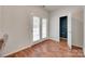 Room with hardwood floors, natural light from french doors, and access to an adjacent room at 727 Torrey Pines Ln, Fort Mill, SC 29715