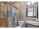 Cozy bathroom with a vanity, framed mirror, and decorative shower curtain at 8409 Olde Stonegate Ln, Mint Hill, NC 28227